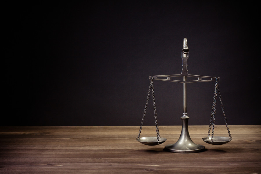 上海刑事律師解讀:冒充國家機關(guān)工作人員進行詐騙的罪行認定